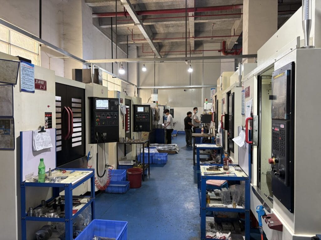 cnc machining factory floor with operators.jpg