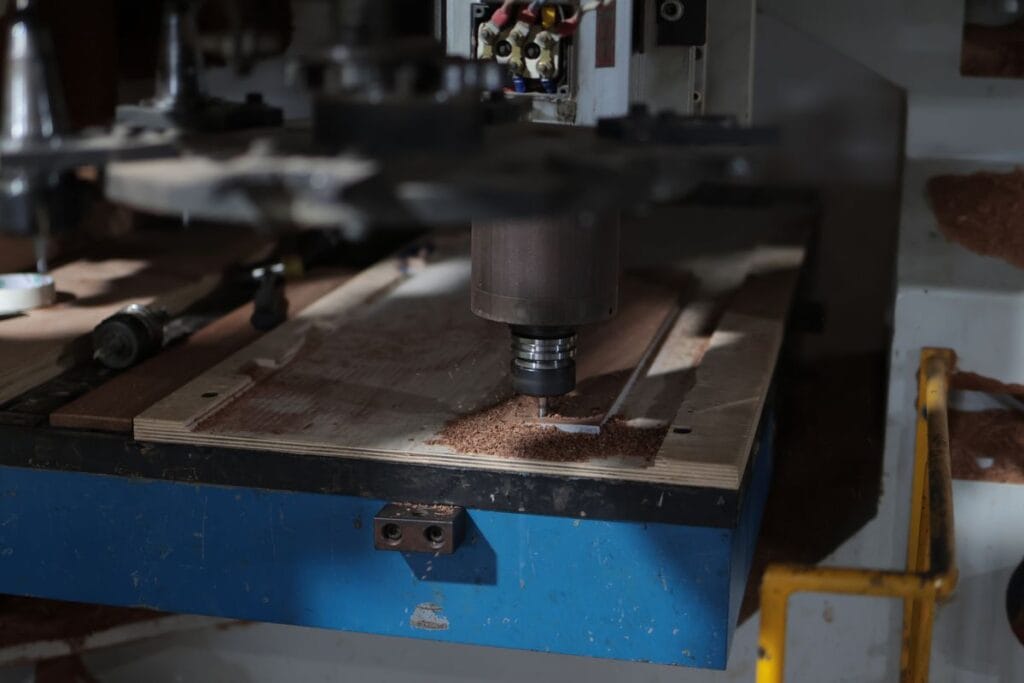 cnc router wood panel sawdust workshop