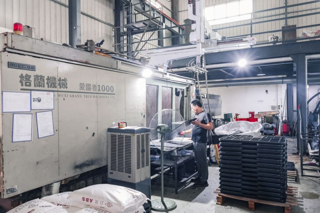 factory injection molding machine worker plastic parts