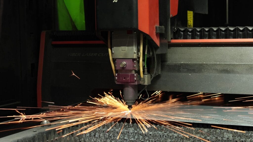 fiber laser cutting machine steel sheet sparks dark.jpg