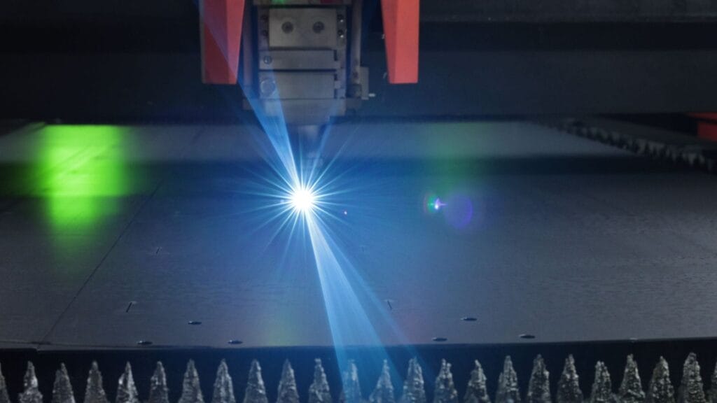 fiber laser cutting steel sheet blue beam sparks.jpg