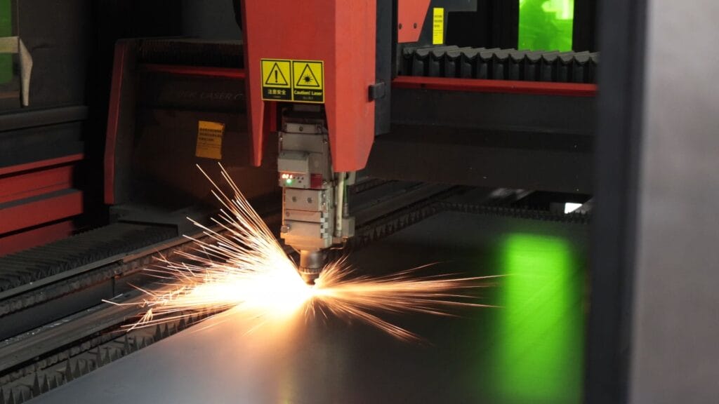 fiber laser cutting steel sheet intense sparks closeup.jpg