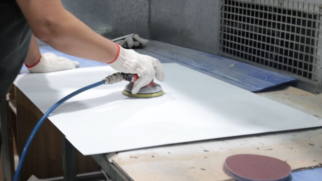 surface sanding steel panel orbital sander wide view.jpg