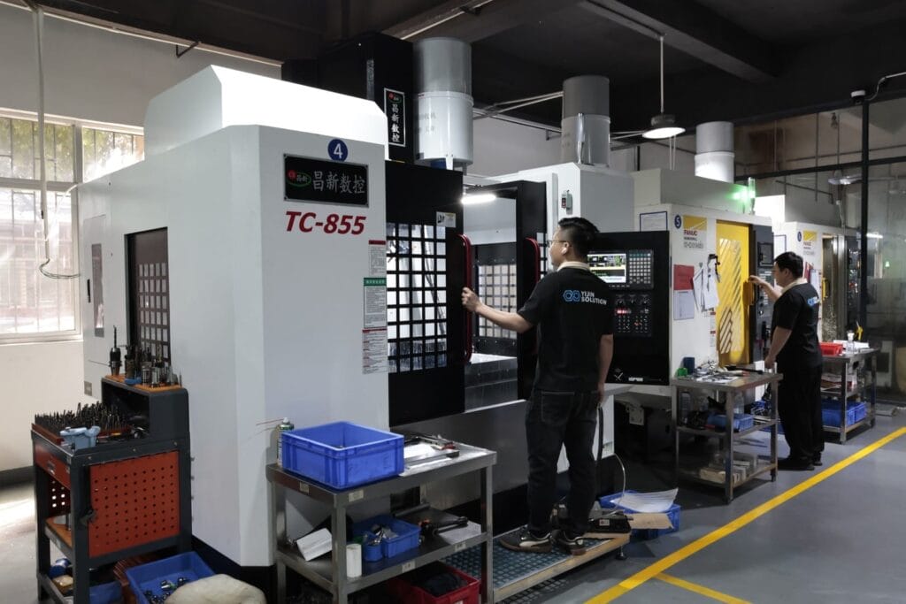 tc855 cnc machining center with operator.jpg